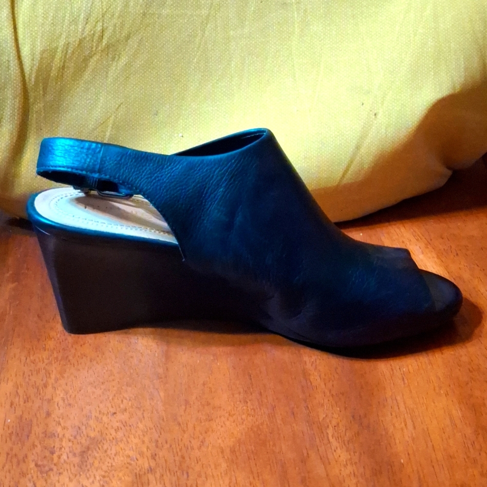 A size 7 black nurture peep toe wedge